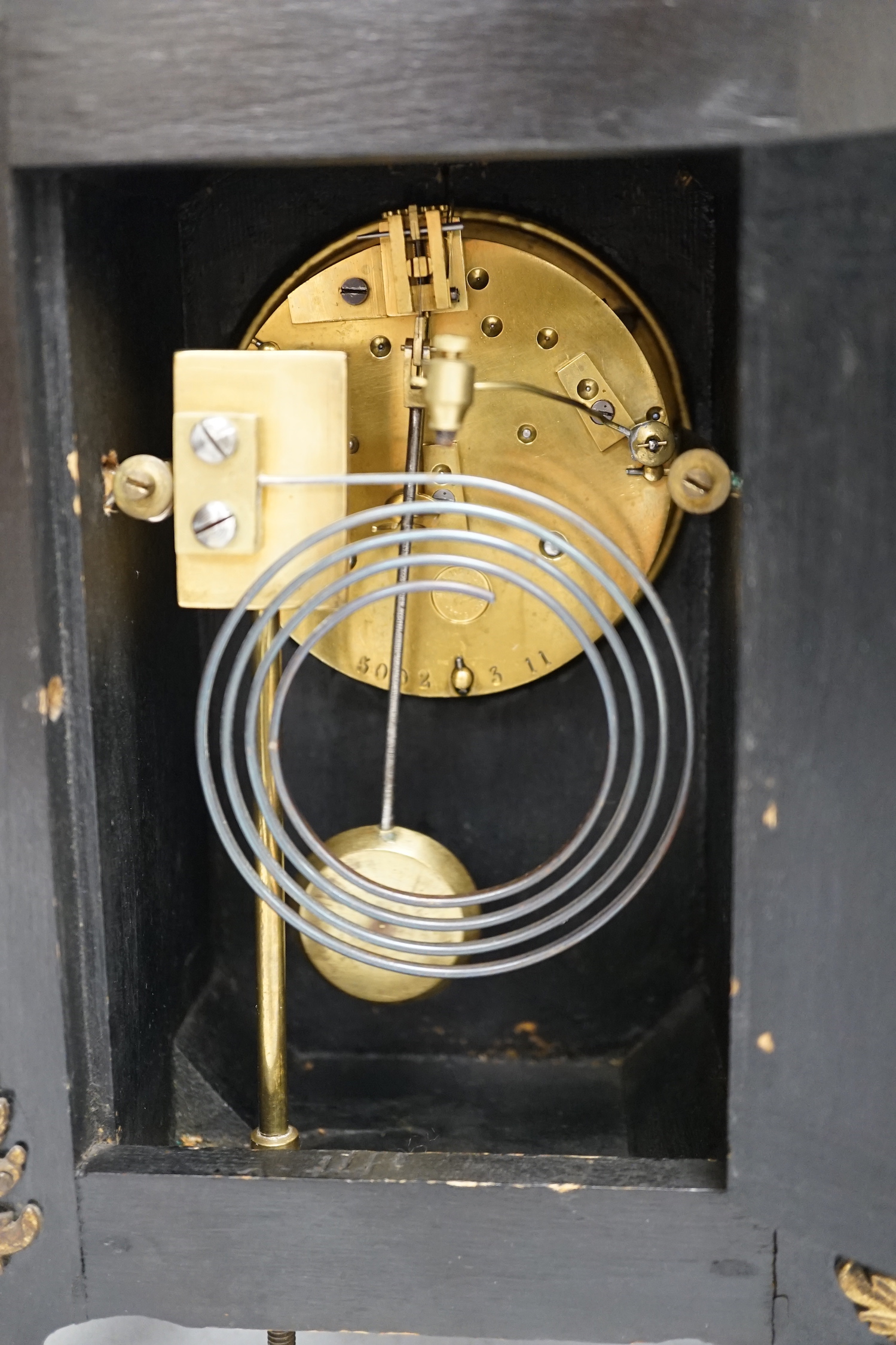 A late 19th century French tortoiseshell veneered mantel clock with cupid top, striking on a coiled gong, dial signed Benson, London, 39.5cm